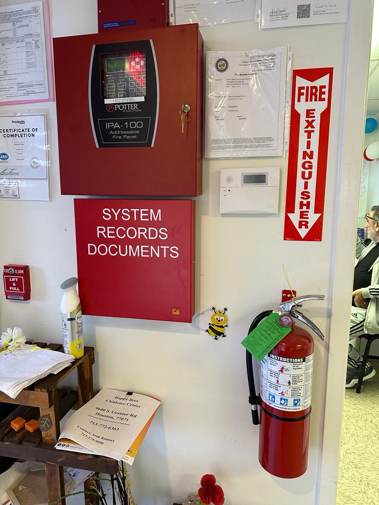 Fire alarm panel, System record document box and Fire extinguisher