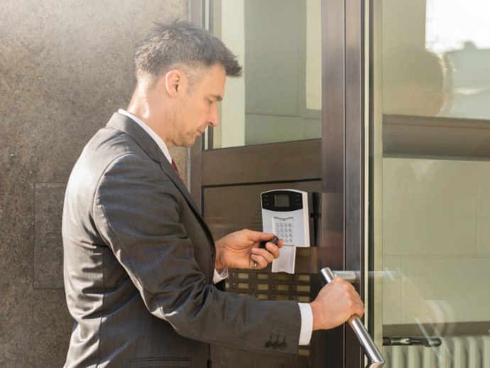 Man using remote control for to open door